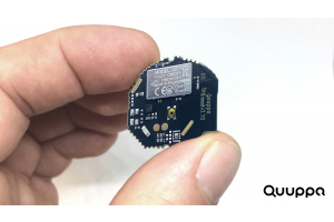 QT1 image being held to show size.