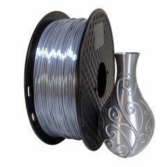 Silver PLA + on a plastic spool. 1 kilo